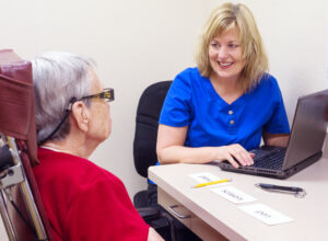 therapist with elderly patient