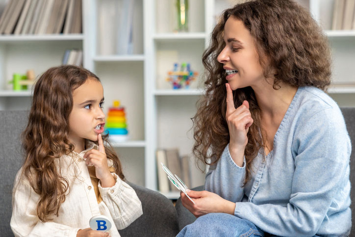 young girl in speech therapy